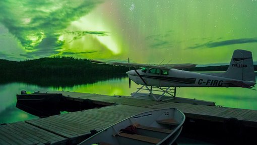 Northern lights above a float plane at Andrew Lake Lodge.