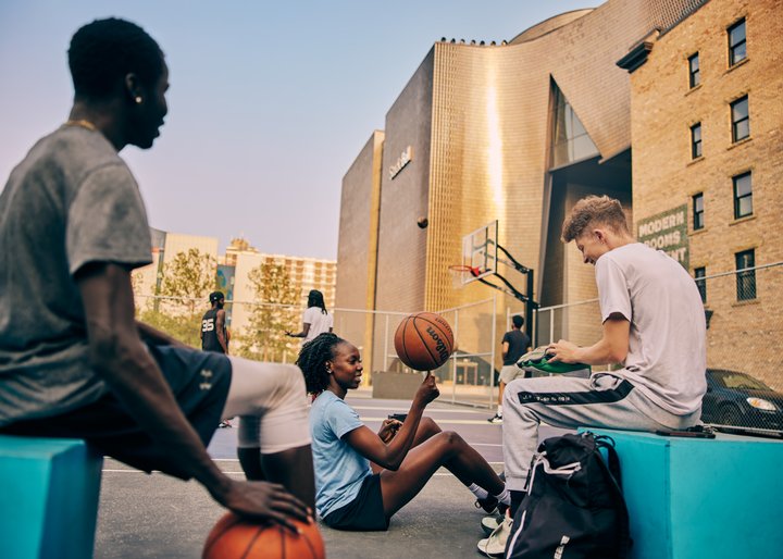 A group of friends plays basketball at The Bounce in East Village