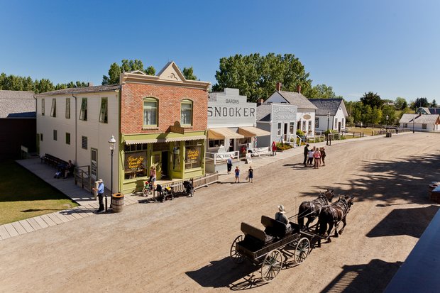 Historic buildings in a heritage park on a sunny day.