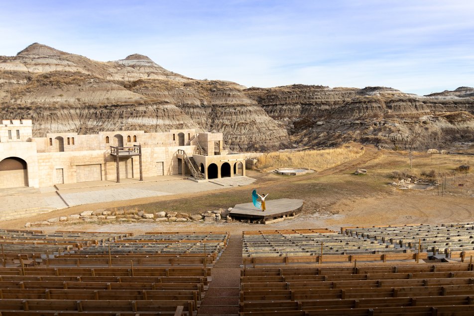 An Indigenous dancer performs on stage at the Badlands Amphitheatre in Drumheller.