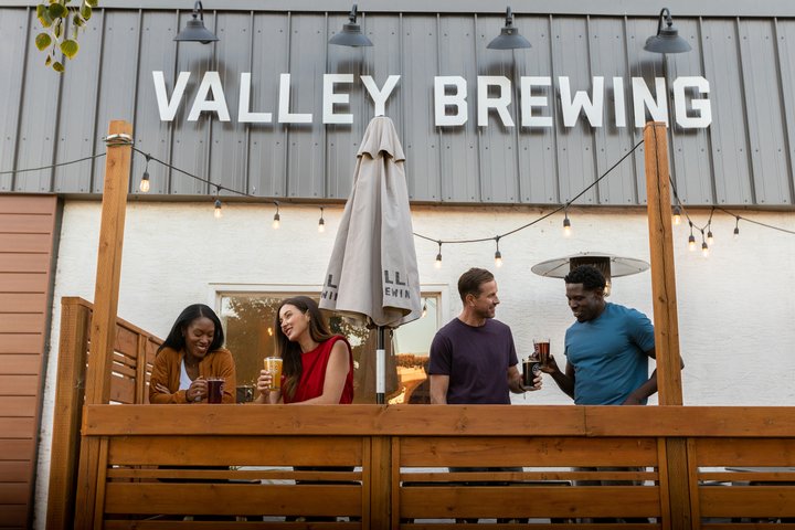 Friends enjoying a beer at Valley Brewing in Drumheller.