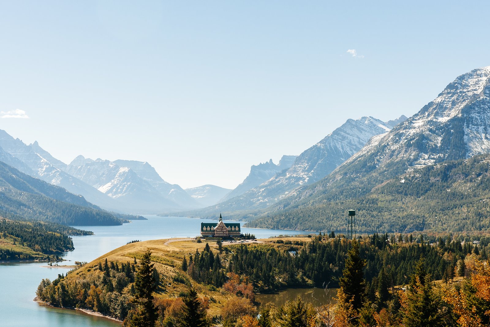Prince of Wales Hotel in Waterton Lakes National Park with Canadian Rocky mountains landscape behind it.