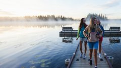 People on the pier at Twin Lakes Rocky Mountain House