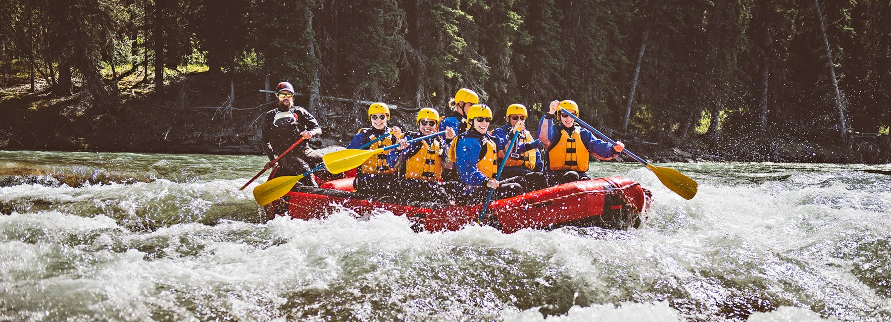 Group on a raft from Mukwah Rafting going down Panther River.