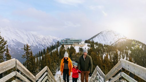 Family walking the board walk at Banff Gondola in Banff National Park