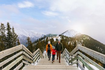 Family walking the board walk at Banff Gondola in Banff National Park