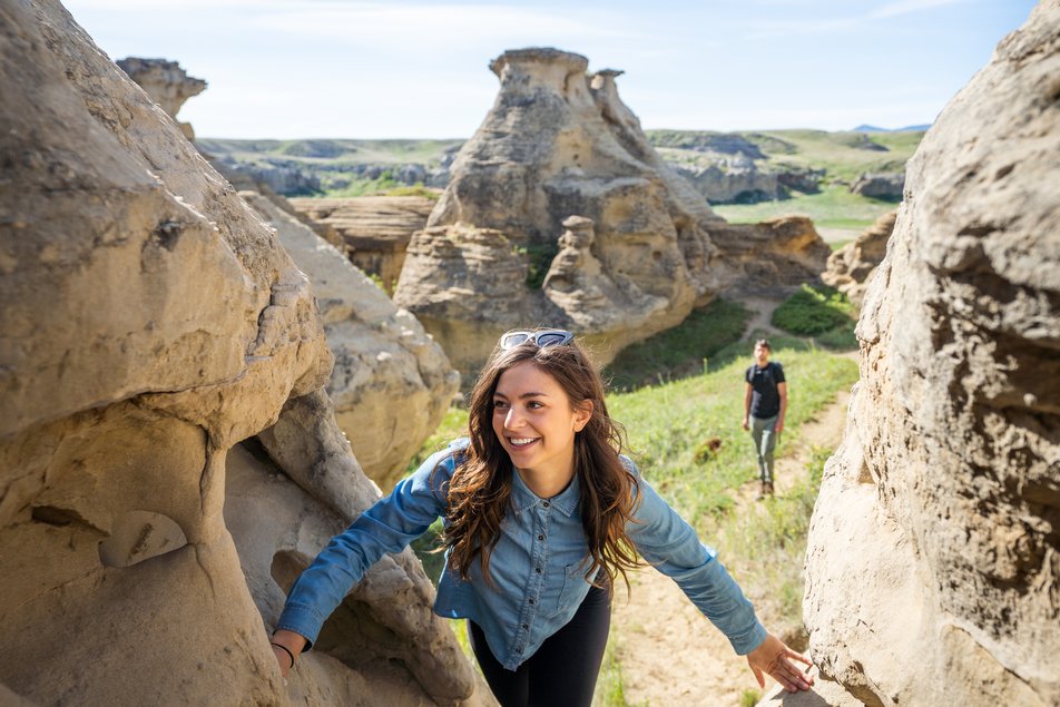 People exploring the trails and rock art at Writing-on-Stone Provincial Park