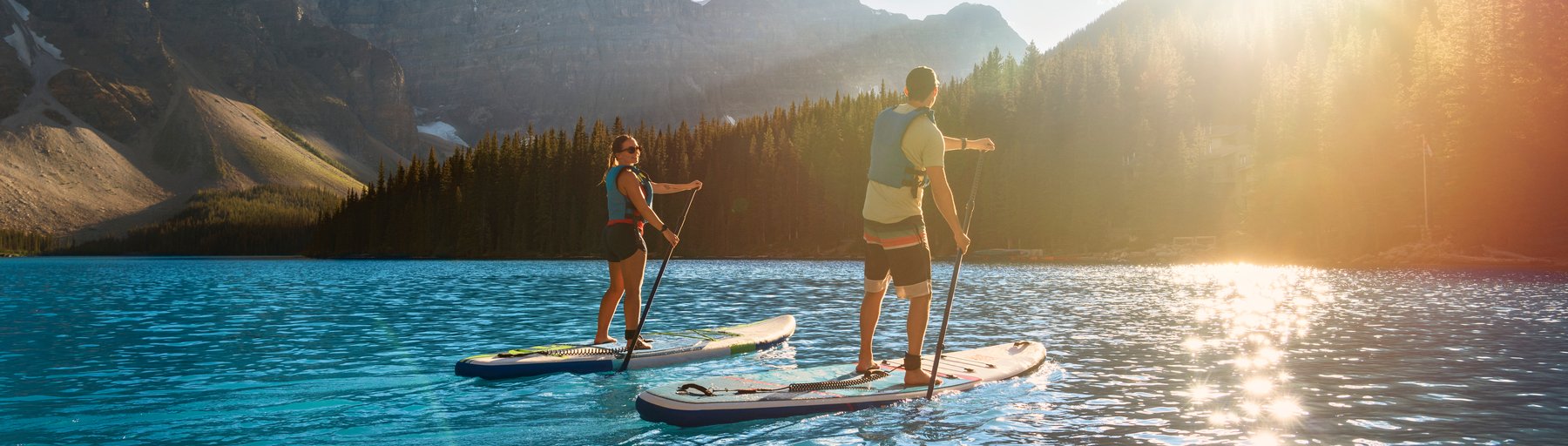 Couple paddle boarding on Peyto Lake in Banff National Park