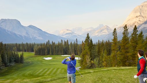 Golfers teeing off at Kananaskis Country Golf Course.