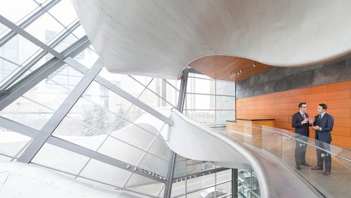 Businessmen meeting inside the Art Gallery of Alberta in Edmonton