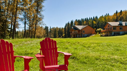 Two Adirondack chairs at The Prairie Creek Inn
