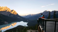 A couple overlooking Peyto Lake in Banff National Park.