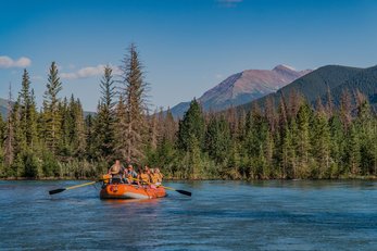 A group of people rafting down a river