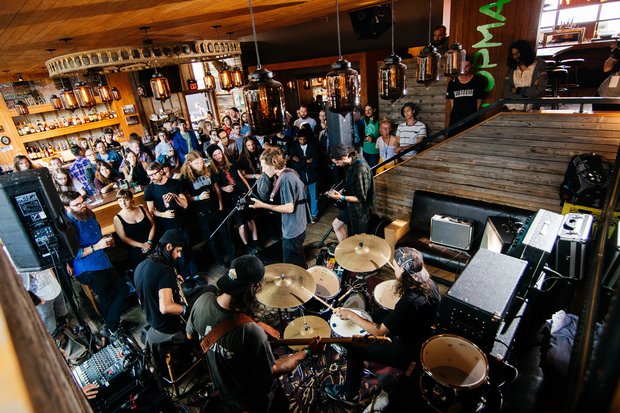 Musicians playing for a crowd inside a bar during the Sled Island Festival in Calgary.