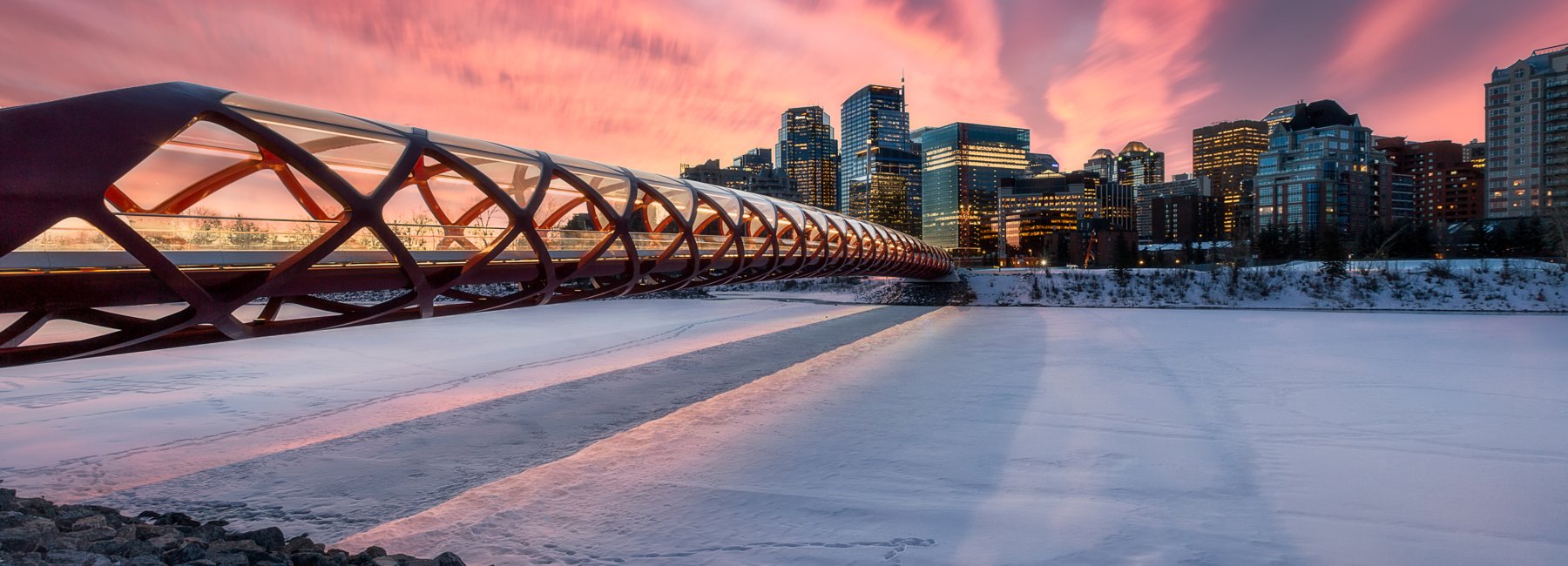 Winter sunrise/sunset scene of Peace Bridge in Calgary.