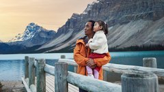 Father and daughter enjoying Bow Lake in Banff National Park