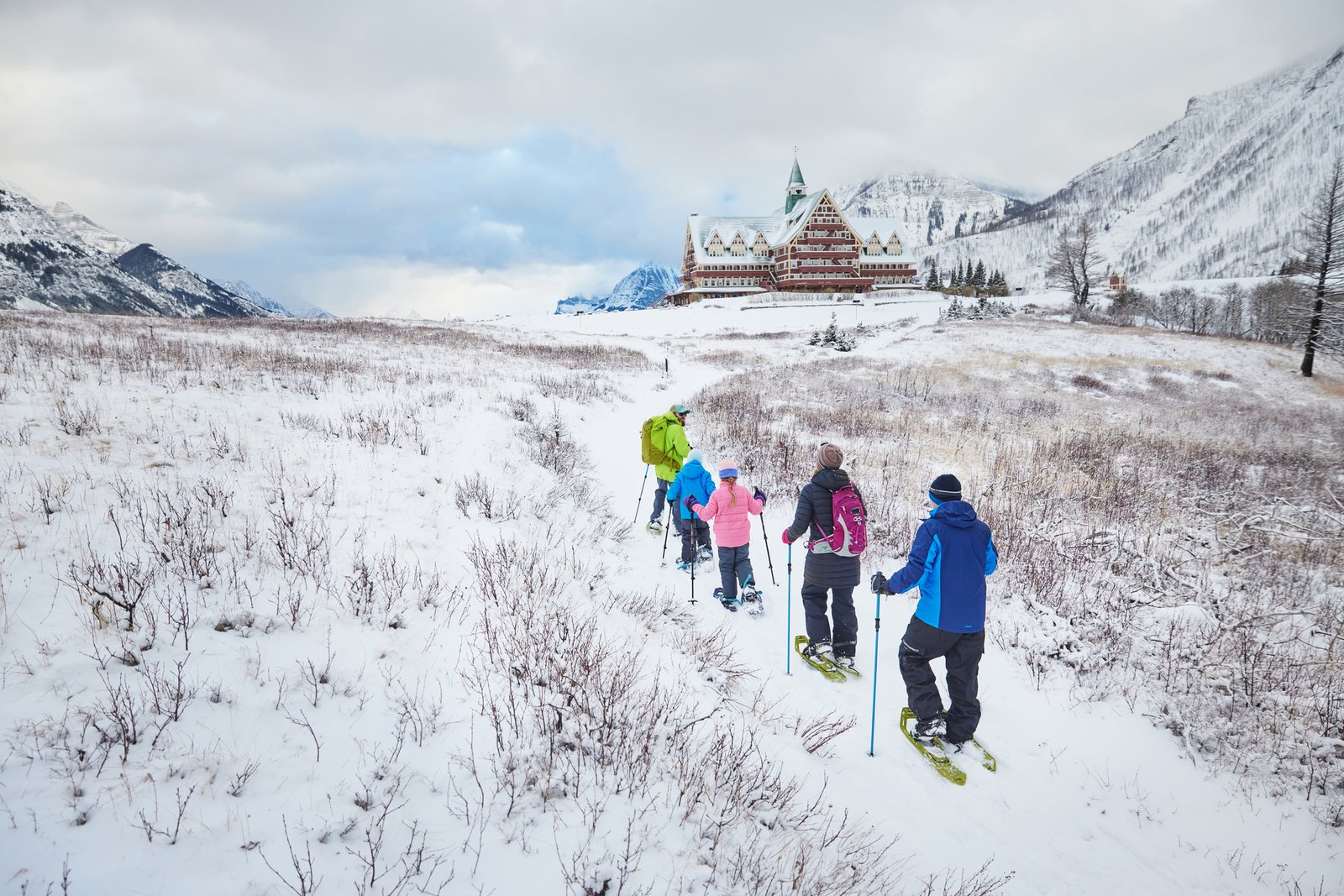 A family enjoys a guided snowshoe tour in Waterton.