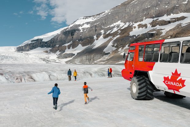 Family getting of a bus on the Columbia Icefield Glacier tour