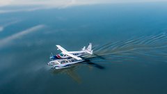 Float plane landing on a lake