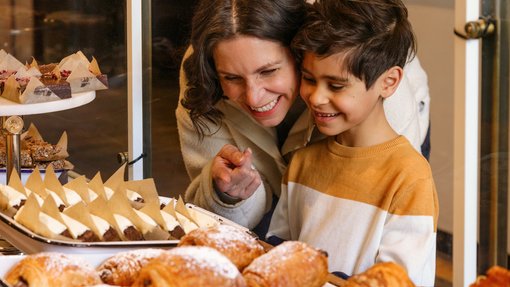 Mother and child excitedly admire and select a pastry at Sidewalk Citizen Bakery in Calgary’s East Village
